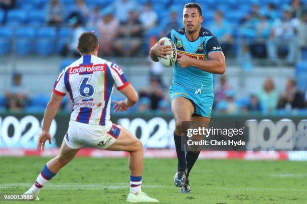 Ryan James of the Titans runs the ball during the round 11 NRL match between the Gold Coast Titans and the Newcastle Knights at Cbus Super Stadium on...