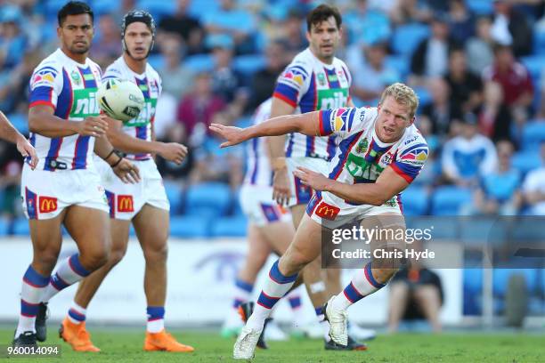 Slade Griffin of the Knights passes during the round 11 NRL match between the Gold Coast Titans and the Newcastle Knights at Cbus Super Stadium on...