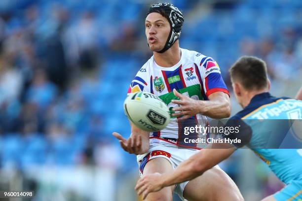 Kalyn Ponga of the Knights passes during the round 11 NRL match between the Gold Coast Titans and the Newcastle Knights at Cbus Super Stadium on May...