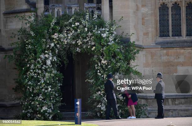 Flower arrangers complete last-minute preparations at Windsor Castle before the wedding of Prince Harry to Meghan Markle on May 19, 2018 in Windsor,...