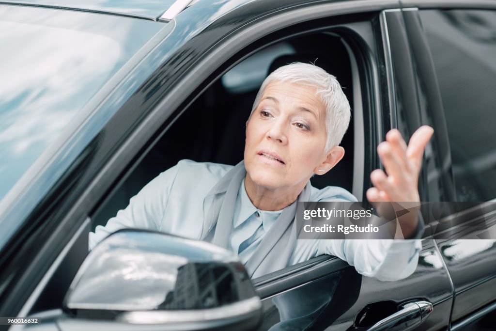 Nervous business woman in a car