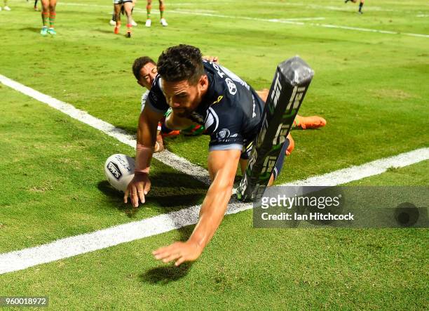 Antonio Winterstein of the Cowboys scores a try during the round 11 NRL match between the North Queensland Cowboys and the South Sydney Rabbitohs at...