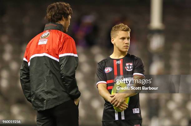 Dylan Roberton and Jack Lonie of the Saints looks on before the round nine AFL match between the St Kilda Saints and the Collingwood Magpies at...