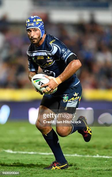 Johnathan Thurston of the Cowboys runs the ball during the round 11 NRL match between the North Queensland Cowboys and the South Sydney Rabbitohs at...