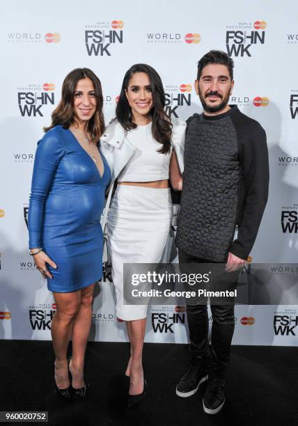 Elisa Dahan, actress Meghan Markle and Eran Elfassy attend World MasterCard Fashion Week Fall 2015 Collections Day 3 at David Pecaut Square on March...