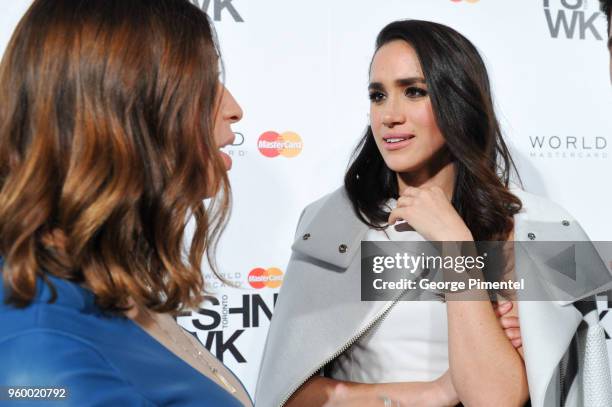 Elisa Dahan and actress Meghan Markle attend World MasterCard Fashion Week Fall 2015 Collections Day 3 at David Pecaut Square on March 25, 2015 in...