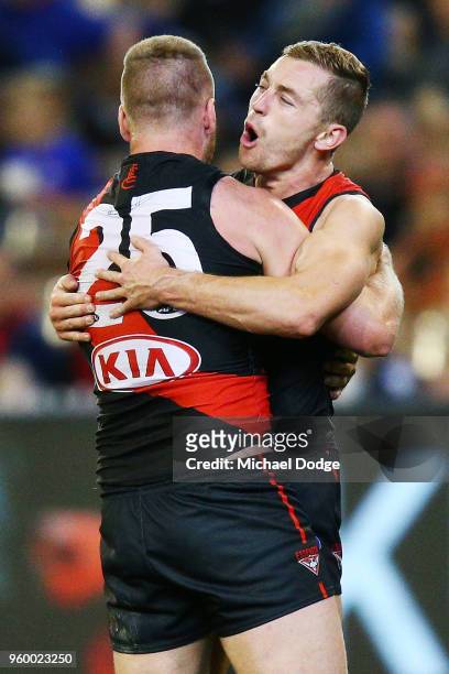 Jake Stringer of Essendon celebrates a goal with Devon Smith of Essendon during the round nine AFL match between the Essendon Bombers and the Geelong...