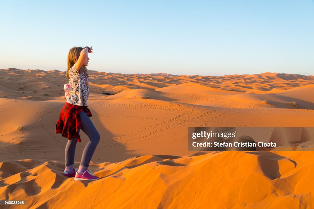 Girl exploring Sahara desert near Merzouga, Morocco