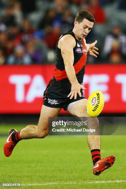 Conor McKenna of the Bombers kicks the ball for a long goal during the round nine AFL match between the Essendon Bombers and the Geelong Cats at...