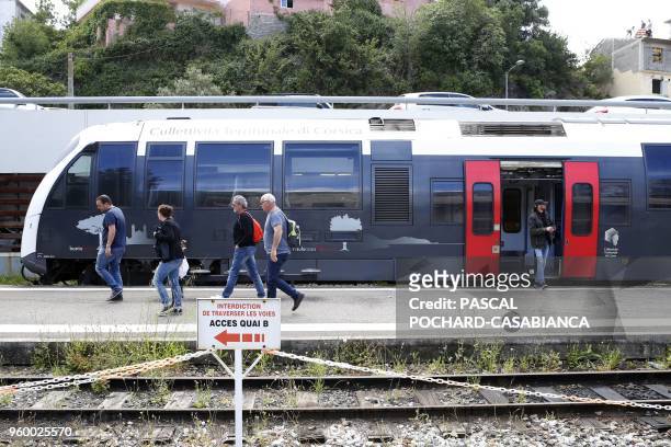People step out the train in Bastia railway station on May 15, 2018 in Bastia on the French Mediterranean island of Corsica.