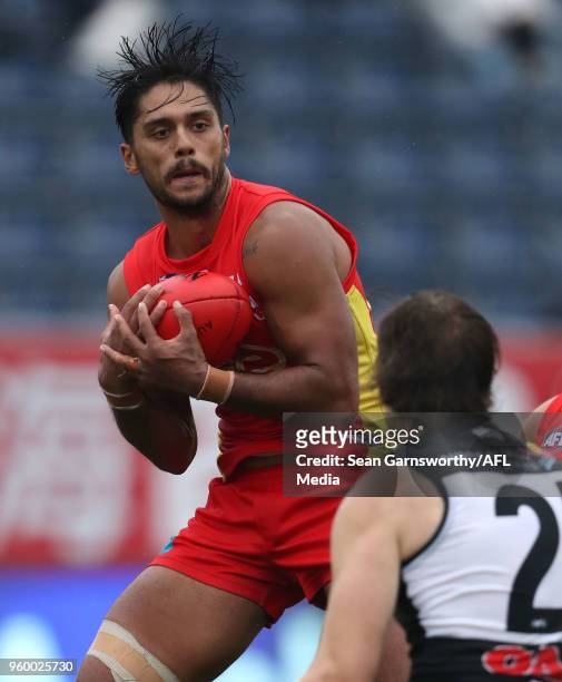 Aaron Hall of the Suns marks during the 2018 AFL round nine match between the Gold Coast Suns and the Port Adelaide Power at Adelaide Arena at...