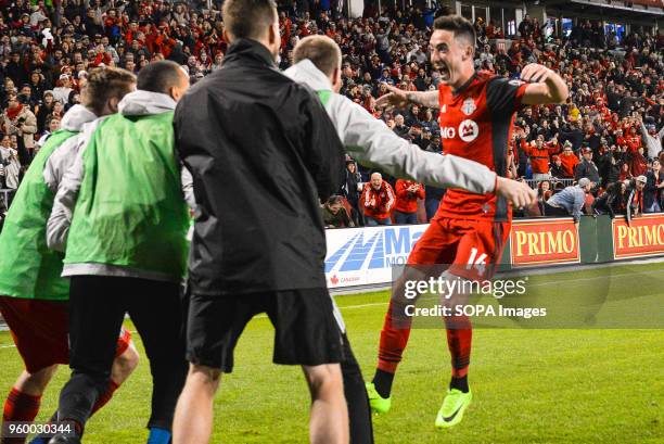 Jay Chapman celebrates the goal scored with teammates during 2018 MLS Regular Season match between Toronto FC and Orlando City SC at BMO Field .