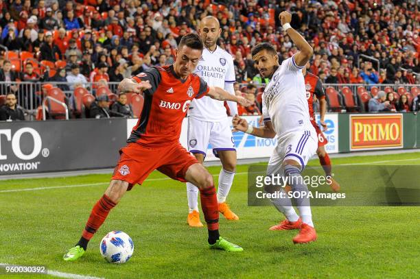 Jay Chapman tried to get the ball during 2018 MLS Regular Season match between Toronto FC and Orlando City SC at BMO Field .