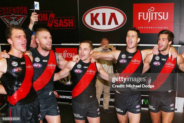 Bombers players sing the club song after winning during the round nine AFL match between the Essendon Bombers and the Geelong Cats at Melbourne...