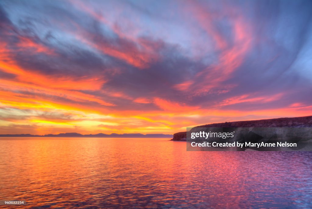 Firey Sky and Large Water Reflection at sunset