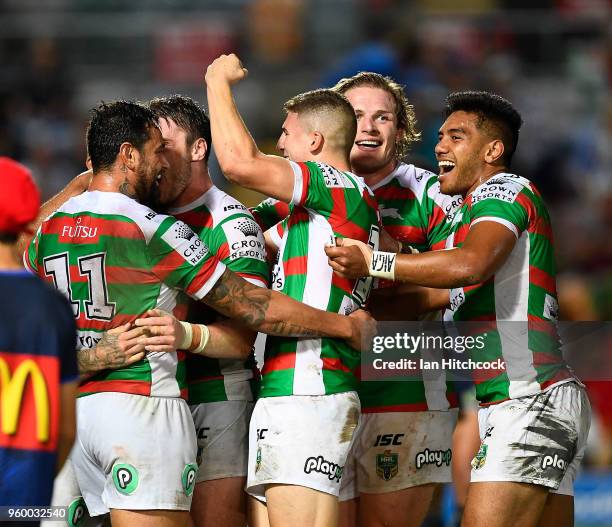 The Rabbitohs celebrate after winning the round 11 NRL match between the North Queensland Cowboys and the South Sydney Rabbitohs at 1300SMILES...