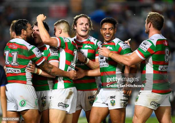 The Rabbitohs celebrate after winning the round 11 NRL match between the North Queensland Cowboys and the South Sydney Rabbitohs at 1300SMILES...