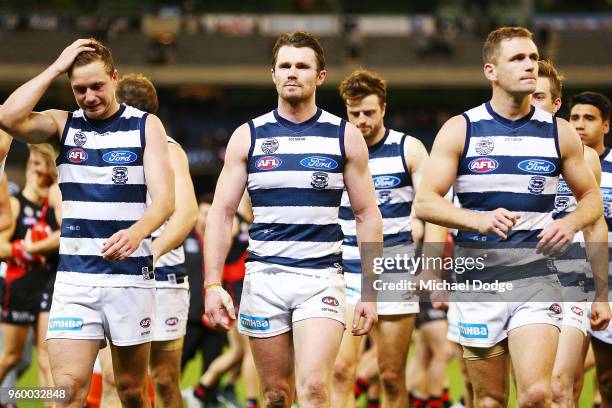 Mitch Duncan Patrick Dangerfield and Joel Selwood lead the team off after defeat during the round nine AFL match between the Essendon Bombers and the...