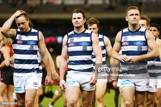 Mitch Duncan Patrick Dangerfield and Joel Selwood lead the team off after defeat during the round nine AFL match between the Essendon Bombers and the...