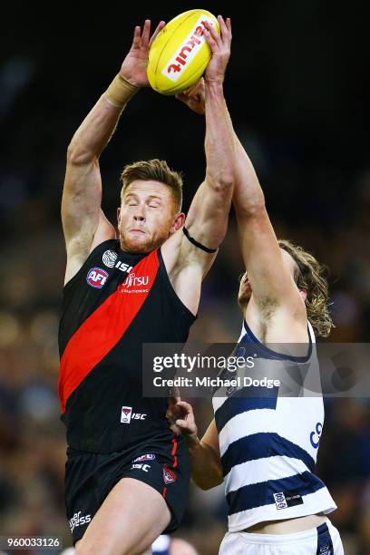 Jayden Laverde of the Bombers competes for the ball against Jake Kolodjashnij of the Cats during the round nine AFL match between the Essendon...