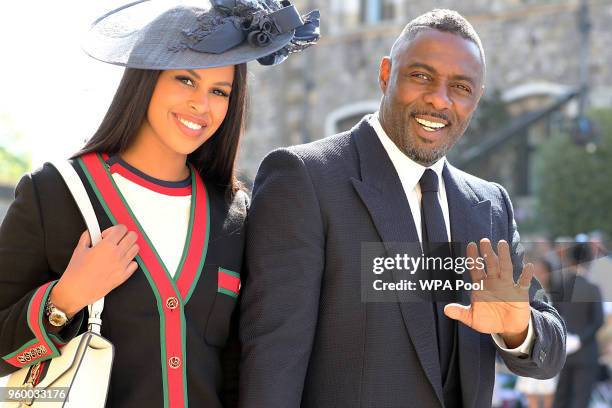 Idris Elba and Sabrina Dhowre arrive at St George's Chapel at Windsor Castle before the wedding of Prince Harry to Meghan Markle on May 19, 2018 in...