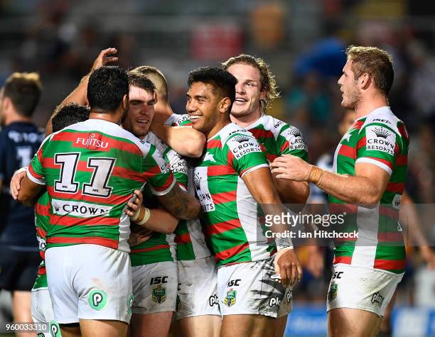 The Rabbitohs celebrate after winning the round 11 NRL match between the North Queensland Cowboys and the South Sydney Rabbitohs at 1300SMILES...