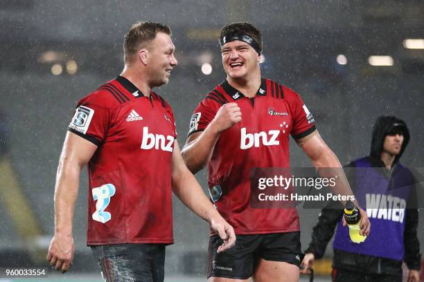Wyatt Crockett celebrates with Scott Barrett of the Crusaders after winning the round 14 Super Rugby match between the Blues and the Crusaders at...