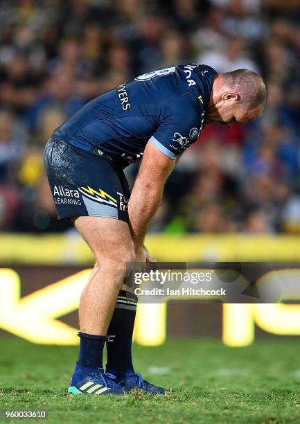 Matthew Scott of the Cowboys holds his knee after being injured during the round 11 NRL match between the North Queensland Cowboys and the South...