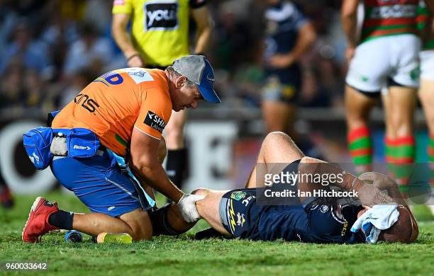 Matthew Scott of the Cowboys recieves treatment after being injured during the round 11 NRL match between the North Queensland Cowboys and the South...