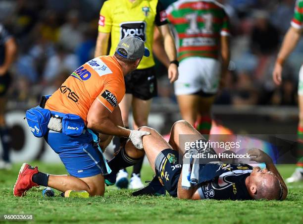 Matthew Scott of the Cowboys recieves treatment after being injured during the round 11 NRL match between the North Queensland Cowboys and the South...