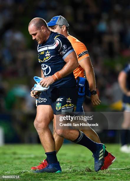 Matthew Scott of the Cowboys comes from the field after being injured during the round 11 NRL match between the North Queensland Cowboys and the...