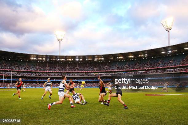 General view is seen as Sam Menegola of the Cats handballs during the round nine AFL match between the Essendon Bombers and the Geelong Cats at...