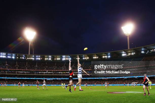 Conor McKenna of the Bombers and James Parsons of the Cats compete for the ball during the round nine AFL match between the Essendon Bombers and the...
