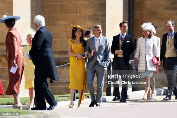 Amal Clooney and George Clooney arrive at the wedding of Prince Harry to Ms Meghan Markle at St George's Chapel, Windsor Castle on May 19, 2018 in...