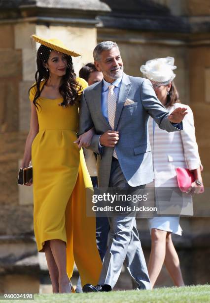 Amal Clooney and George Clooney arrive at the wedding of Prince Harry to Ms Meghan Markle at St George's Chapel, Windsor Castle on May 19, 2018 in...