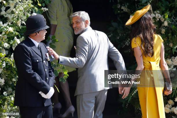 Amal and George Clooney arrive at St George's Chapel at Windsor Castle before the wedding of Prince Harry to Meghan Markle on May 19, 2018 in...