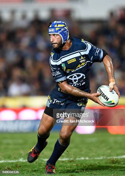 Johnathan Thurston of the Cowboys looks to pass the ball during the round 11 NRL match between the North Queensland Cowboys and the South Sydney...