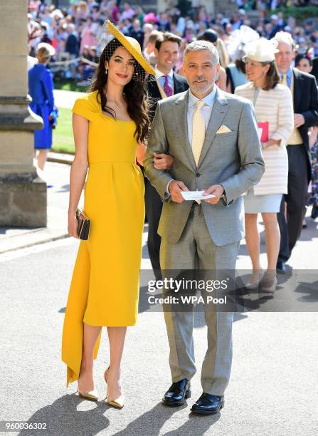 Amal and George Clooney arrive at St George's Chapel at Windsor Castle before the wedding of Prince Harry to Meghan Markle on May 19, 2018 in...