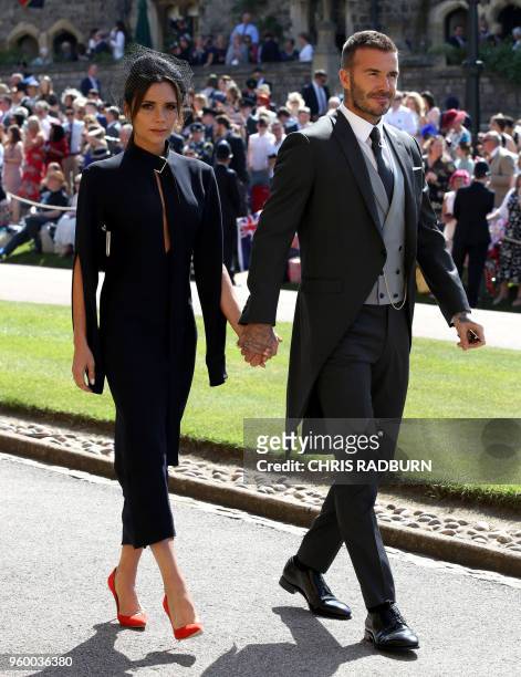 Former England footballer David Beckham and fashion designer Victoria Beckham arrive for the wedding ceremony of Britain's Prince Harry, Duke of...