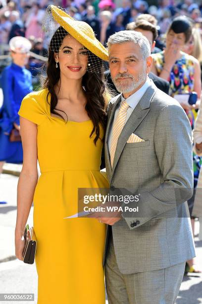 Amal and George Clooney arrive at St George's Chapel at Windsor Castle before the wedding of Prince Harry to Meghan Markle on May 19, 2018 in...