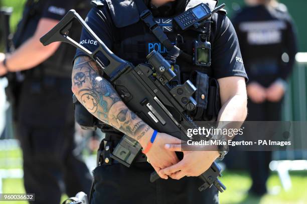 Detail of a police officer holding a gun on Long Walk ahead of the wedding of Prince Harry and Meghan Markle in St George's Chapel in Windsor Castle....