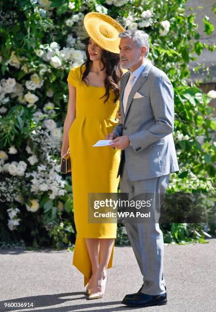 Amal Clooney and George Clooney arrive at St George's Chapel at Windsor Castle before the wedding of Prince Harry to Meghan Markle on May 19, 2018 in...