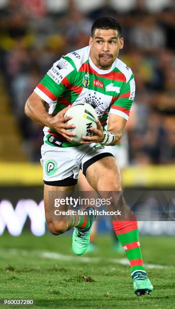 Cody Walker of the Rabbitohs runs the ball during the round 11 NRL match between the North Queensland Cowboys and the South Sydney Rabbitohs at...