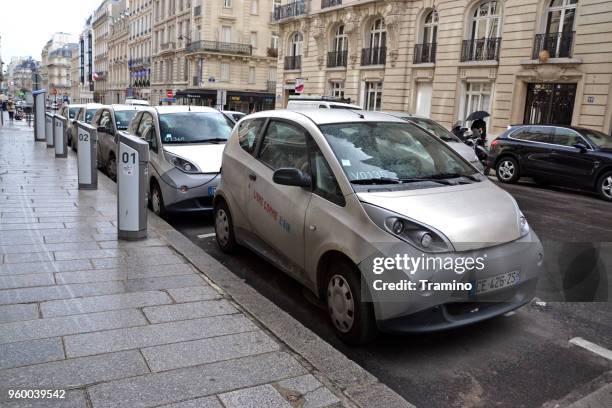 bluecar vehicles on the parking and charging points - bluecar imagens e fotografias de stock