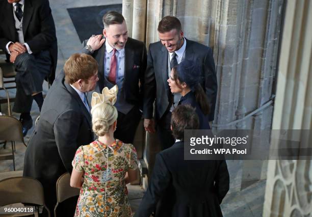 David and Victoria Beckham talk with Sir Elton John and David Furnish and Sofia Wellesley and James Blunt as they arrive in St George's Chapel at...