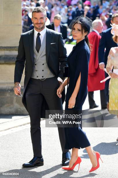 David Beckham and Victoria Beckham arrive at St George's Chapel at Windsor Castle before the wedding of Prince Harry to Meghan Markle on May 19, 2018...