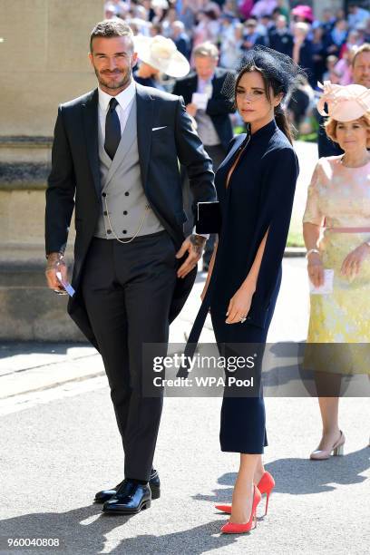 David Beckham and Victoria Beckham arrive at St George's Chapel at Windsor Castle before the wedding of Prince Harry to Meghan Markle on May 19, 2018...