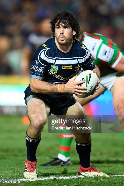 Jake Granville of the Cowboys looks to pass the ball during the round 11 NRL match between the North Queensland Cowboys and the South Sydney...