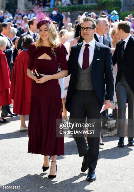 Meghan Markle's friend, US actor Gabriel Macht and wife Jacinda Barrett arrive for the wedding ceremony of Britain's Prince Harry, Duke of Sussex and...