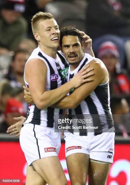 Jordan De Goey of the Magpies and Daniel Wells of the Magpies celebrate after kicking a goal during the round nine AFL match between the St Kilda...
